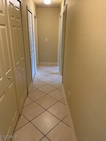 a bathroom with a granite countertop shower and a sink