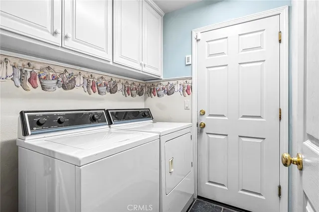 a bedroom with furniture a rug and gym equipment