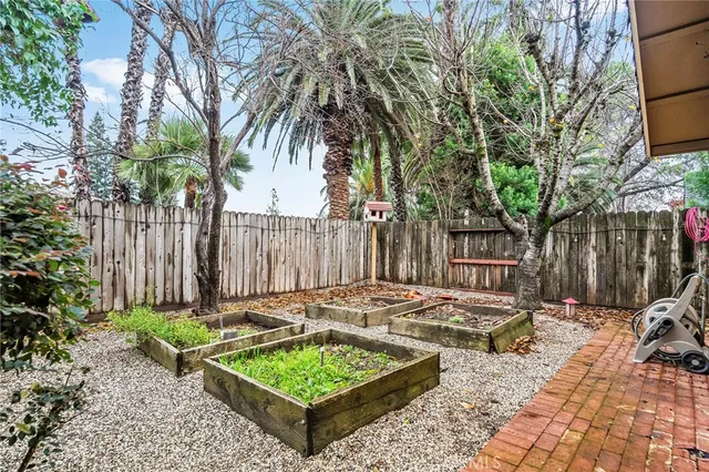 a view of a porch with wooden floor and fence