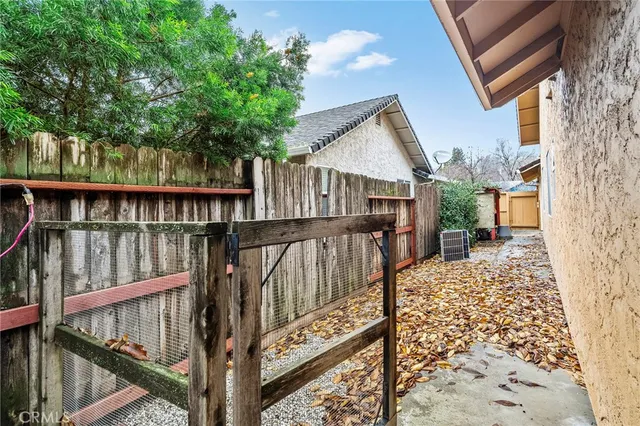 a view of a backyard with plants and a patio