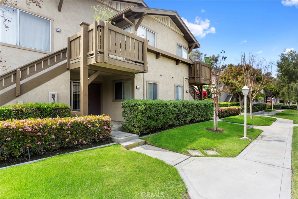 86 Clearbrook, Unit 33 Irvine, CA 92614 - Photo 2 of 20 a view of a house with a yard
