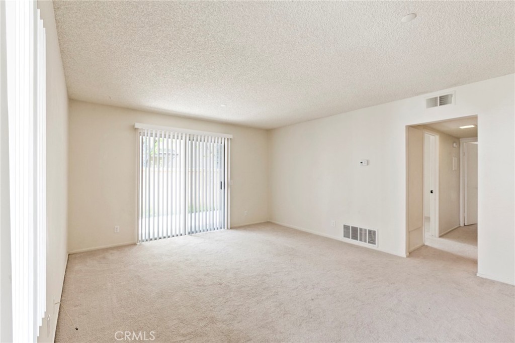 86 Clearbrook, Unit 33 Irvine, CA 92614 - Photo 6 of 20 a view of an empty room with a window