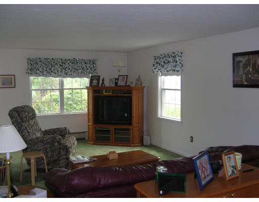 24 Hanson Road Charlton, MA 01507 - Photo 9 of 17 a bedroom with a bed and a window