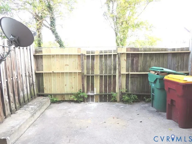 a view of a brick house with a outdoor space