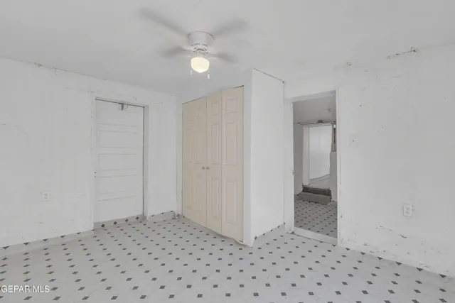 a room that has a rug and a window