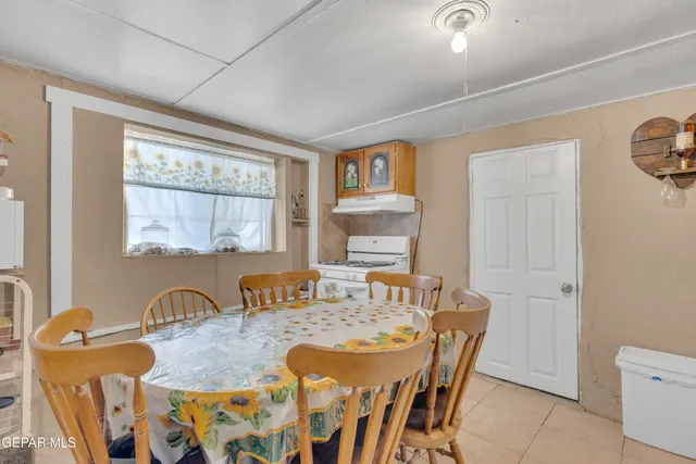 a view of a house with a yard and garage