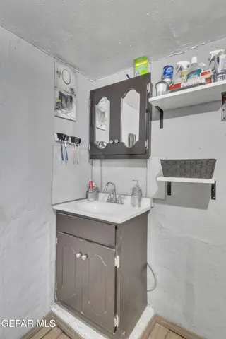 a spacious bathroom with a shower and a sink