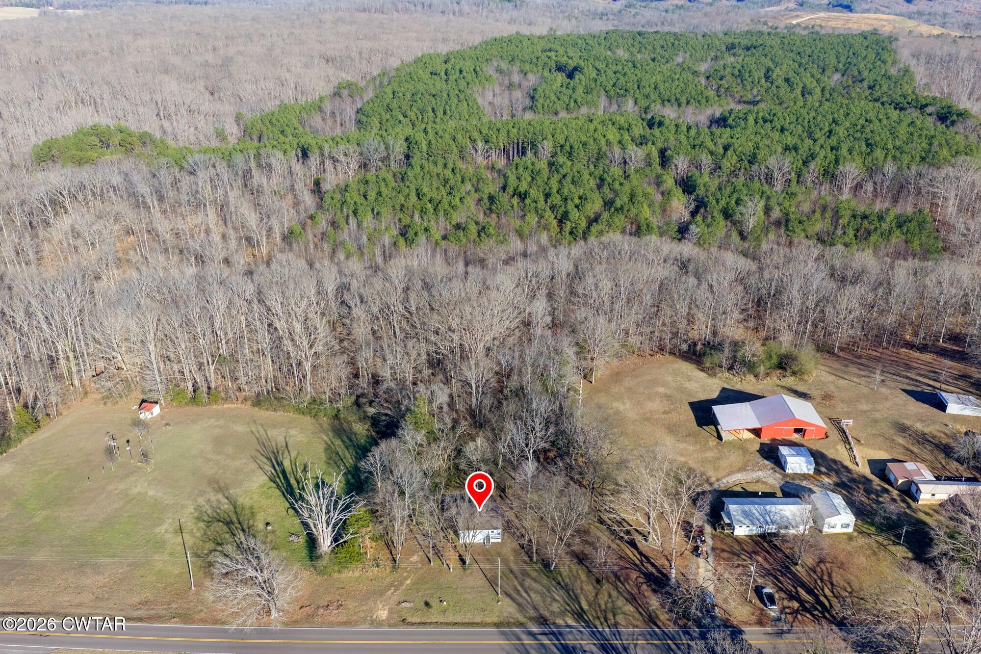 a bird view of a house with a yard