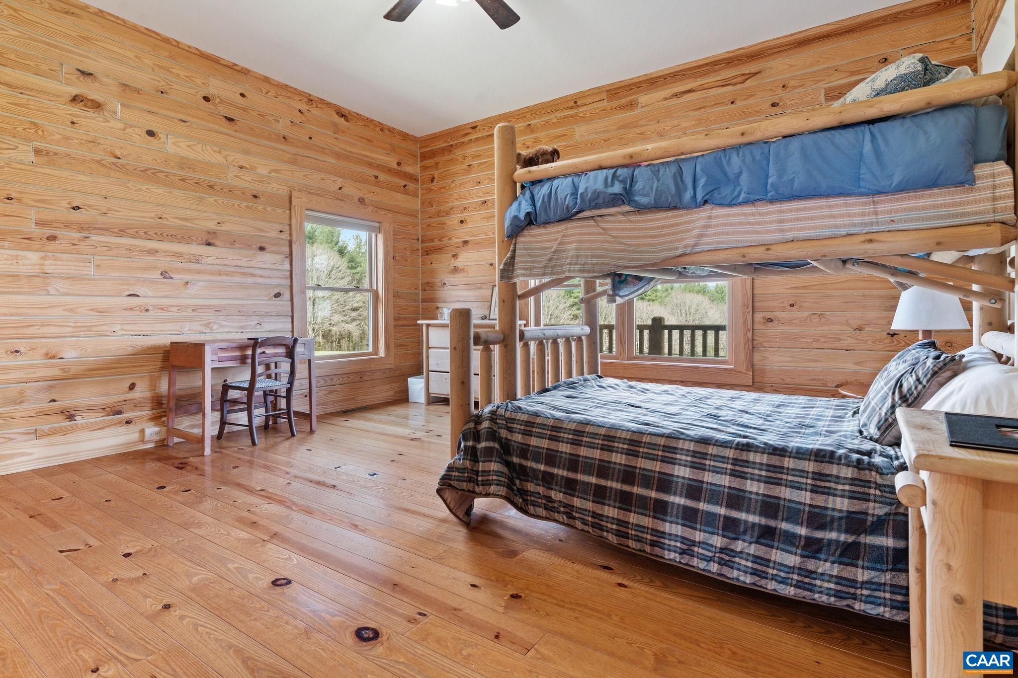 42 River Ridge Lane Stanardsville, VA 22973 - Photo 39 of 70 a bedroom with a bed and wooden floor