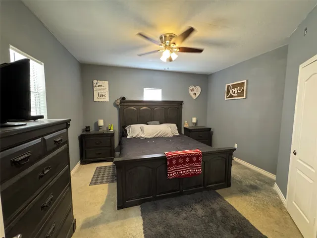 a bed room with a bed and a television