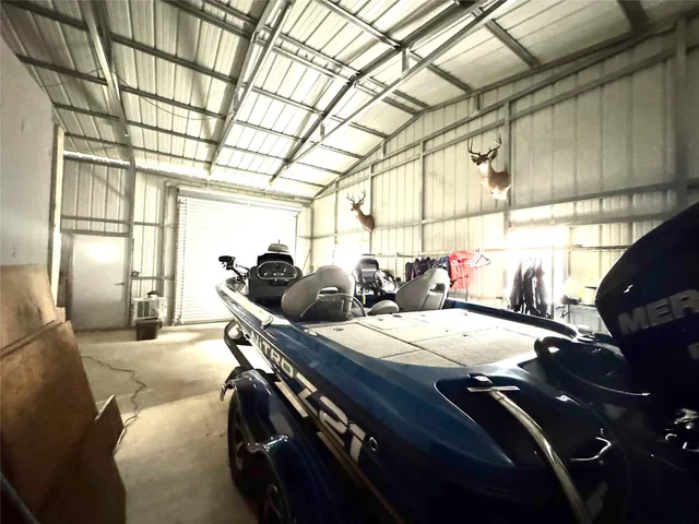 a bed room with a bed and a chandelier