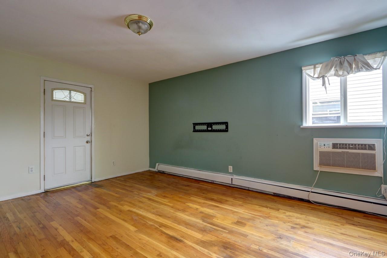 12-67 Waterview Street Queens, NY 11691 - Photo 8 of 14 a view of empty room with window