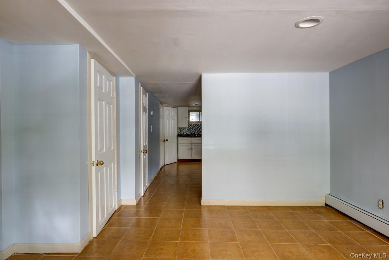 12-67 Waterview Street Queens, NY 11691 - Photo 9 of 14 a view of an empty room