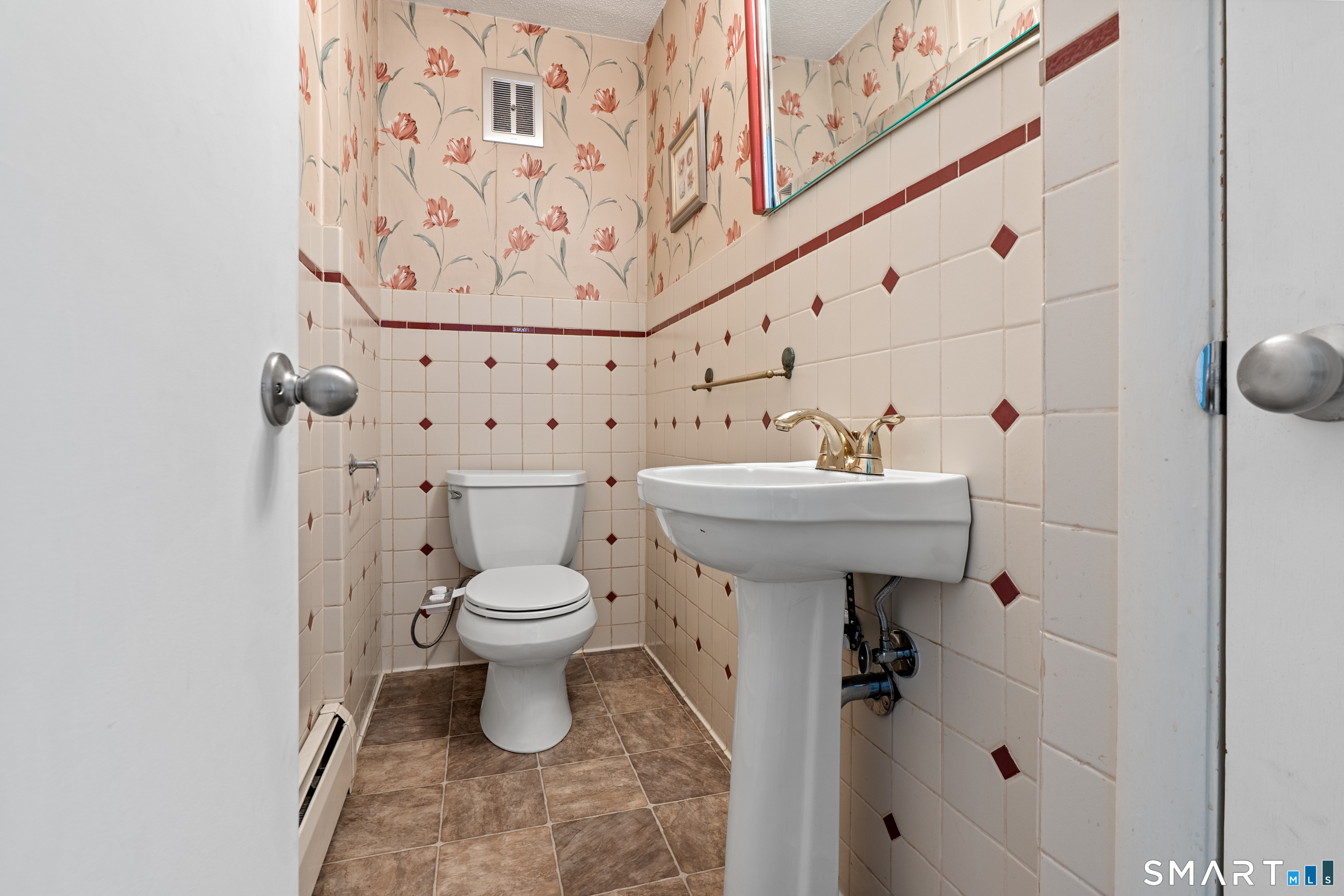 107 Round Hill Road Wethersfield, CT 06109 - Photo 19 of 40 a bathroom with a sink toilet and shower
