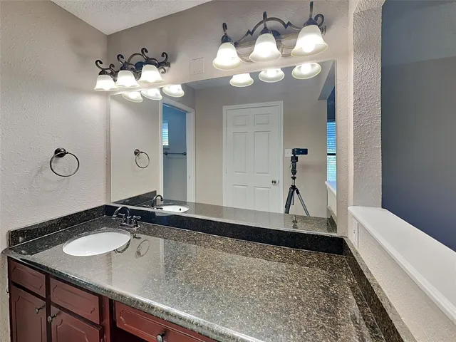 a view of a sink and a mirror