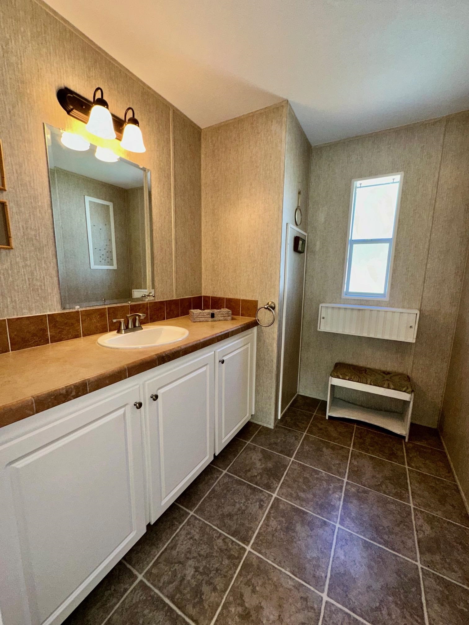292 Majorca Road Butler Beach, FL 32080 - Photo 15 of 27 a spacious bathroom with a double vanity sink and a mirror