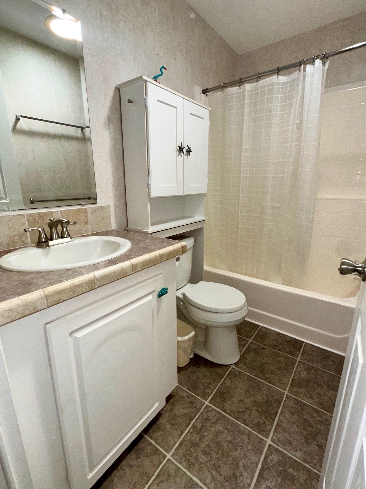 292 Majorca Road Butler Beach, FL 32080 - Photo 17 of 27 a bathroom with a sink toilet and shower