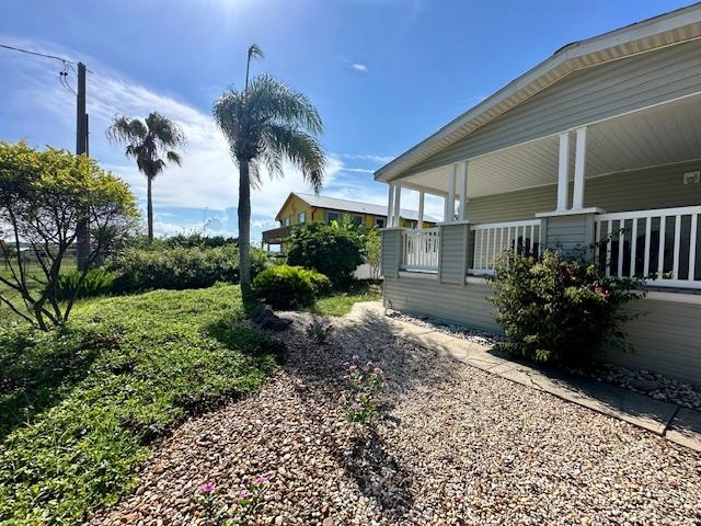 292 Majorca Road Butler Beach, FL 32080 - Photo 2 of 27 a palm tree sitting in front of a house