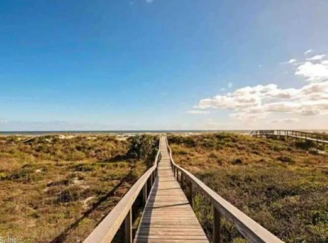 292 Majorca Road Butler Beach, FL 32080 - Photo 22 of 27 a view of a balcony with wooden floor and fence