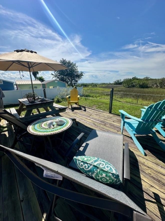 292 Majorca Road Butler Beach, FL 32080 - Photo 25 of 27 a view of a balcony with two chairs and a table