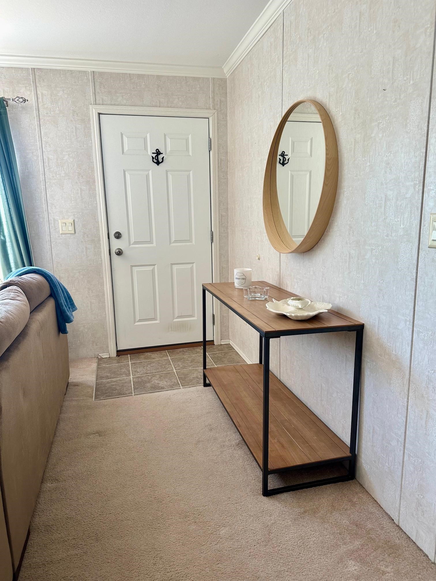 292 Majorca Road Butler Beach, FL 32080 - Photo 3 of 27 a view of a livingroom with furniture and a mirror
