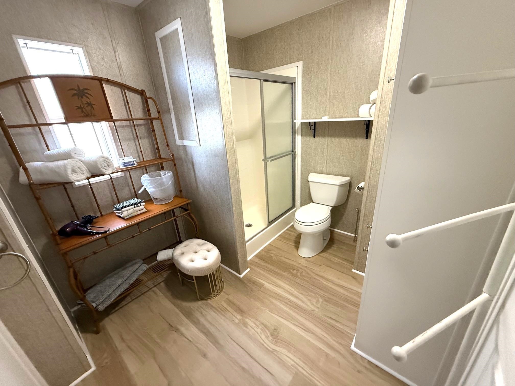 292 Majorca Road St. Augustine, FL 32080 - Photo 29 of 32 Bathroom featuring light wood-type flooring and a stall shower