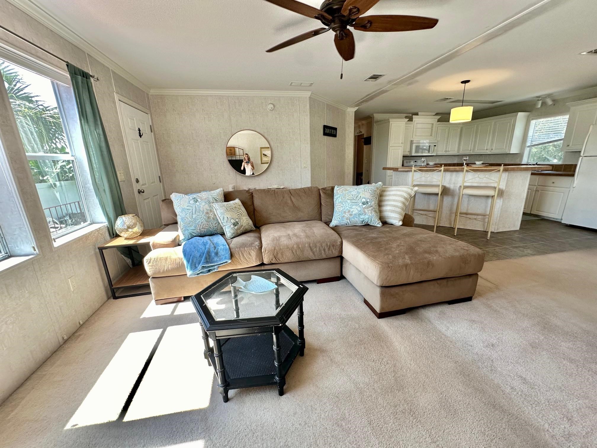 292 Majorca Road Butler Beach, FL 32080 - Photo 5 of 27 a living room with furniture and a large window
