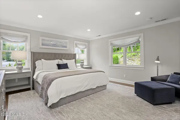 a bedroom with bed and window