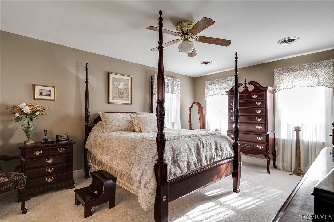 538 Courthouse Road Richmond, VA 23236 - Photo 14 of 24 a bedroom with a bed and a chandelier