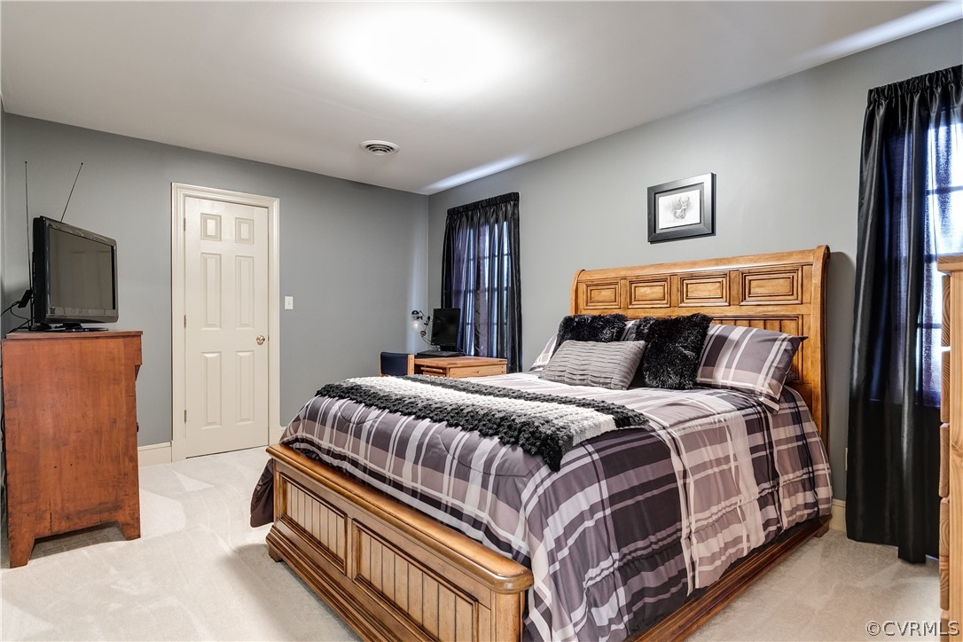 538 Courthouse Road Richmond, VA 23236 - Photo 18 of 24 a bedroom with a bed and a flat screen tv