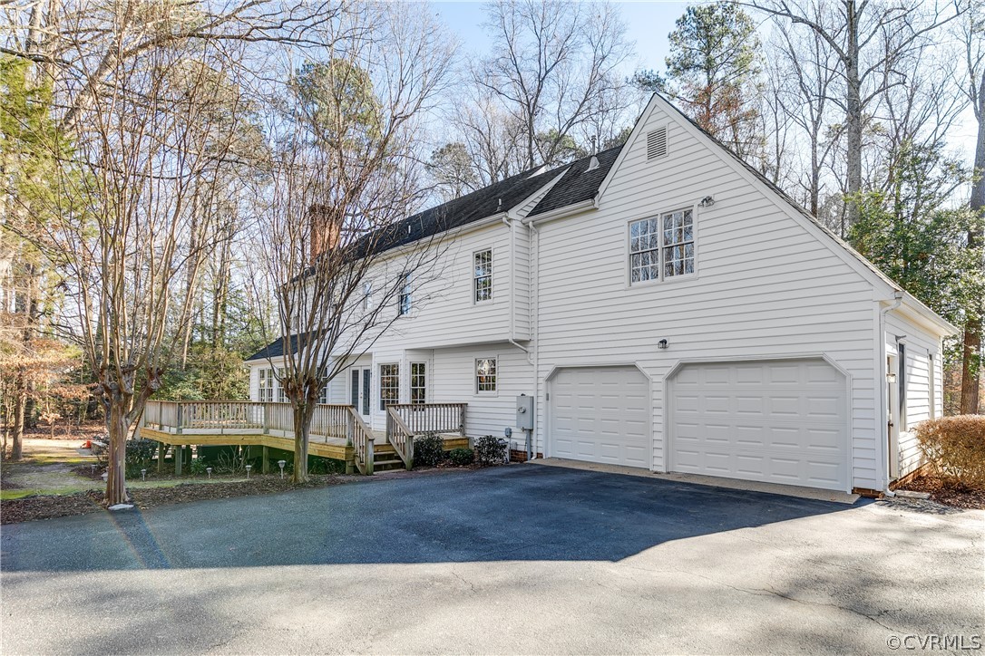 538 Courthouse Road Richmond, VA 23236 - Photo 20 of 24 a view of a white house with a yard and large tree