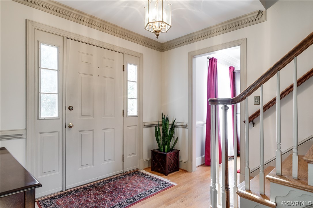 538 Courthouse Road Richmond, VA 23236 - Photo 4 of 24 a view of a hallway with wooden floor and stairs