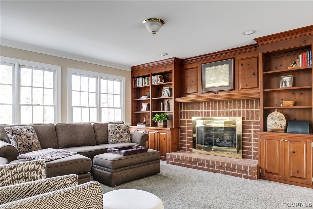 538 Courthouse Road Richmond, VA 23236 - Photo 6 of 24 a living room with furniture and a fireplace