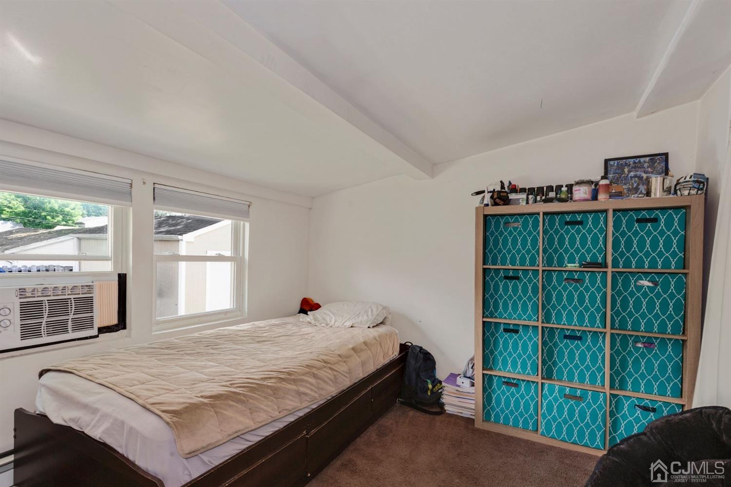 36 Landvale Road Spotswood, NJ 08884 - Photo 11 of 15 a bed sitting in a bedroom next to a window