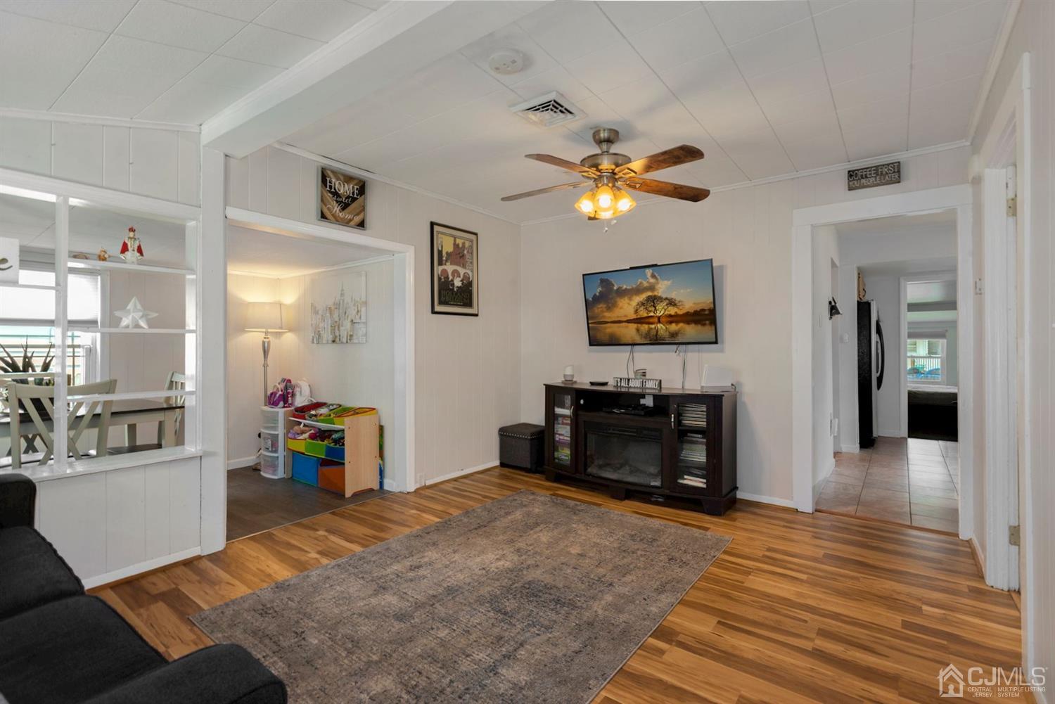 36 Landvale Road Spotswood, NJ 08884 - Photo 3 of 15 a bedroom with furniture and a chandelier