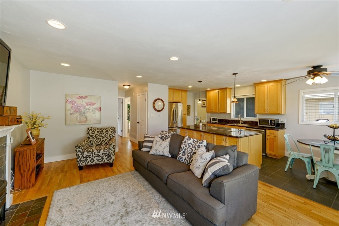 808 Electron Way Fircrest, WA 98466 - Photo 2 of 20 a living room with furniture and a flat screen tv