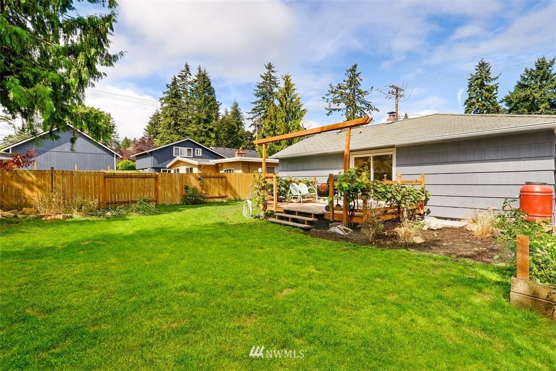 808 Electron Way Fircrest, WA 98466 - Photo 16 of 20 a view of a backyard with table and chairs and potted plants