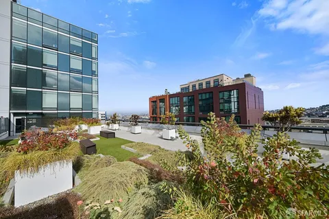 a swimming pool with outdoor seating and yard
