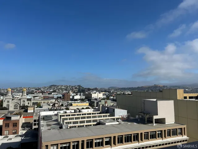 a view of a city with tall buildings