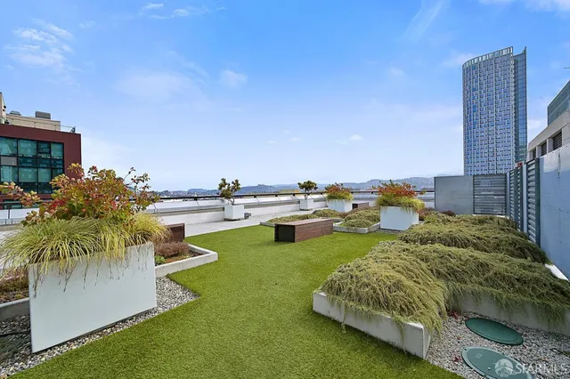 a swimming pool with outdoor seating and yard