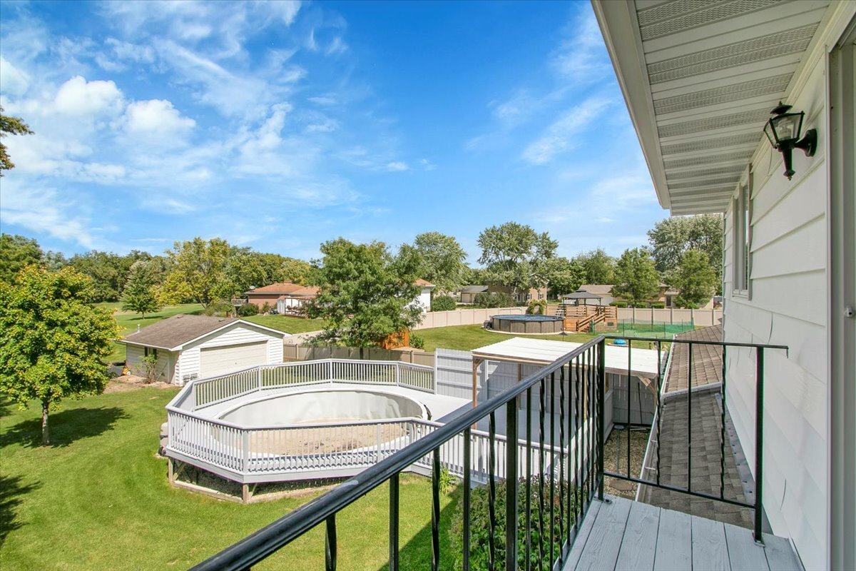 25734 Hickory Court Minooka, IL 60447 - Photo 12 of 35 a view of a balcony with lake view and mountain view