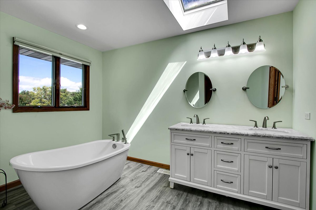 25734 Hickory Court Minooka, IL 60447 - Photo 13 of 35 a bathroom with a granite countertop sink and a mirror