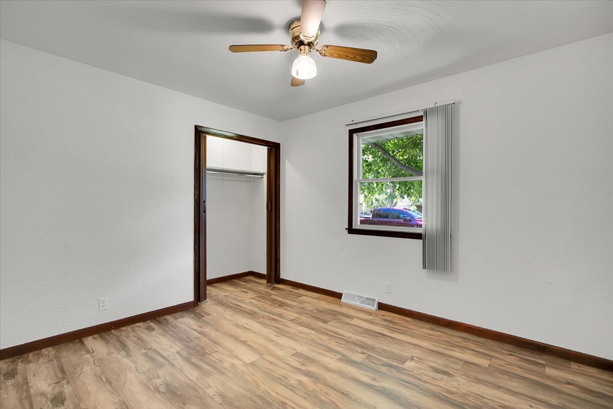 25734 Hickory Court Minooka, IL 60447 - Photo 16 of 35 a view of an empty room with window and wooden floor