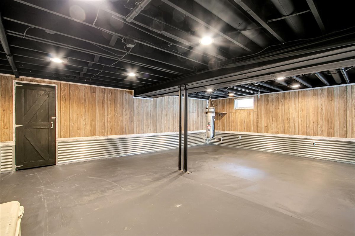 25734 Hickory Court Minooka, IL 60447 - Photo 21 of 35 a view of an empty room with wooden floor and windows
