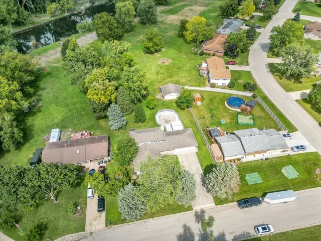 an aerial view of residential house with outdoor space and street view