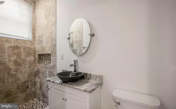 a bathroom with a toilet and a sink