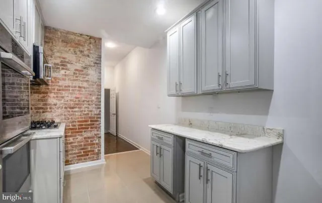 a view of a kitchen with cabinets