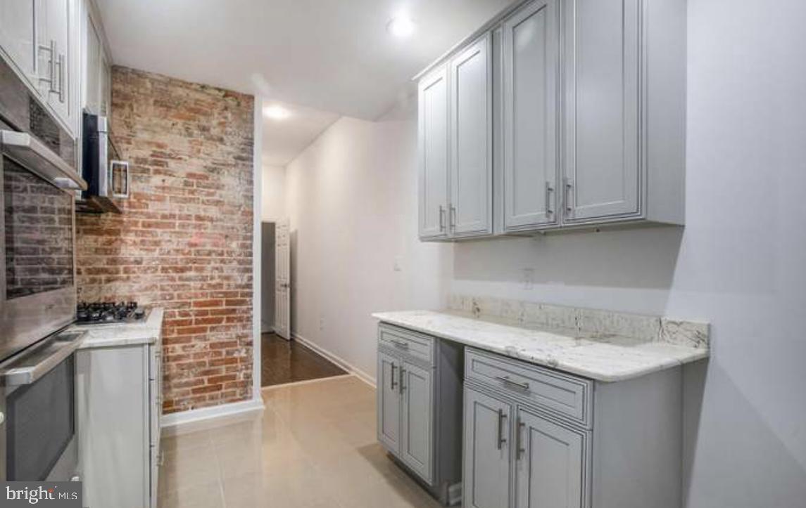 815 North Calhoun Street Baltimore, MD 21217 - Photo 31 of 38 a view of a kitchen with cabinets