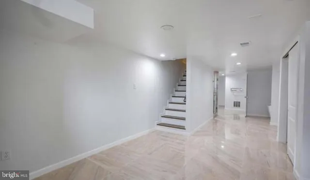 a view of entryway and hall with a window
