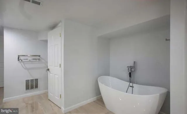 a view of a bathtub in a room